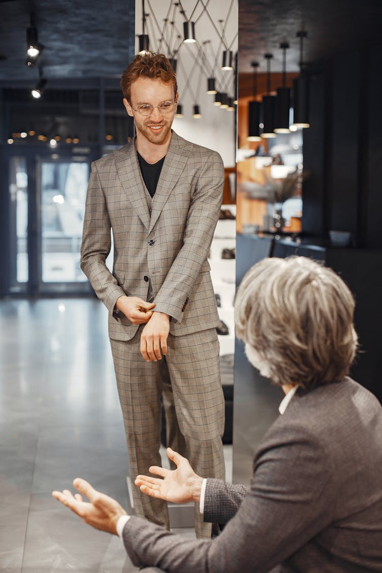 Man Wearing Metal Frame Eyeglasses And Gray Plaid Suit 