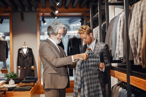 Men in a Boutique Choosing a Suit 