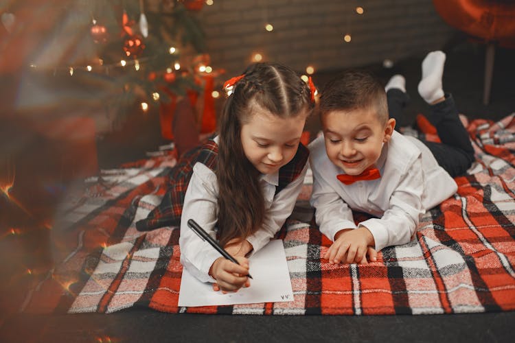 Little Girl And Boy Writing A Letter To Santa Clause