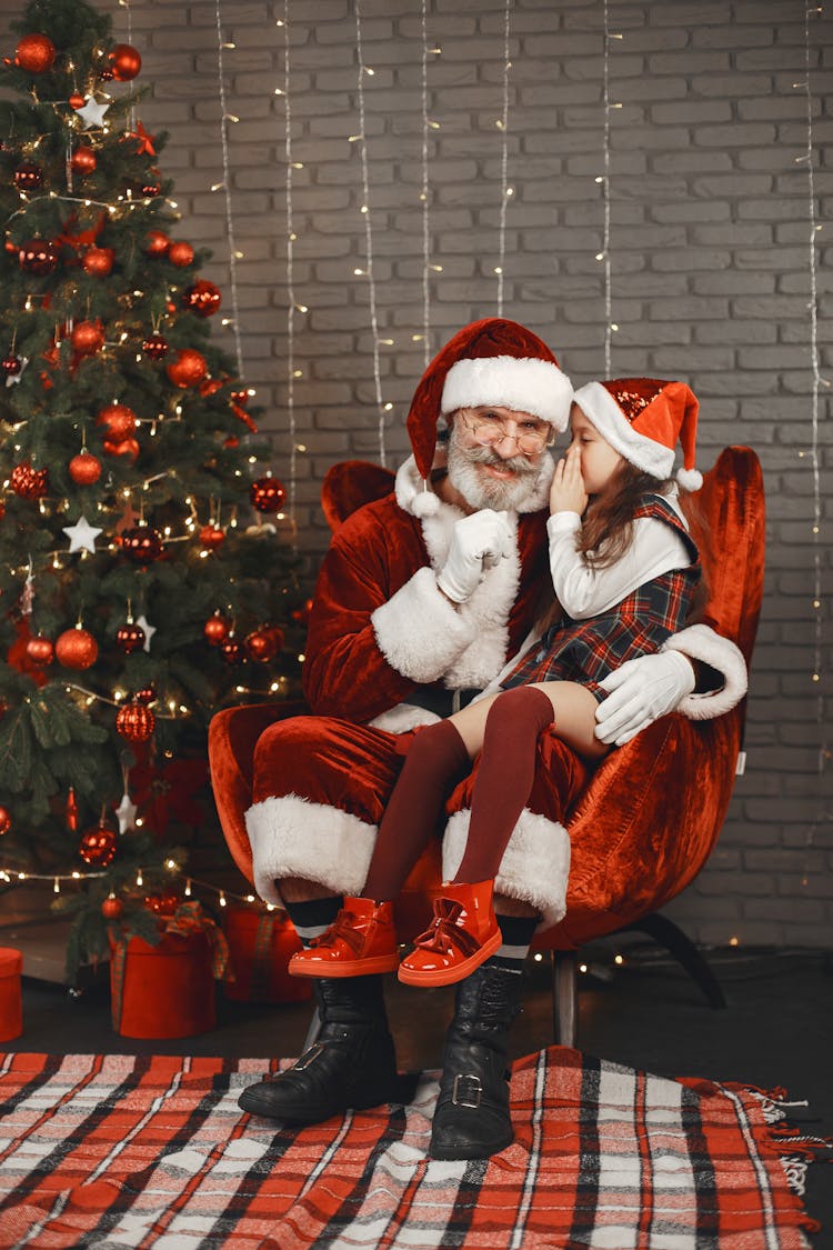 Girl Sitting On The Lap Of Santa Claus