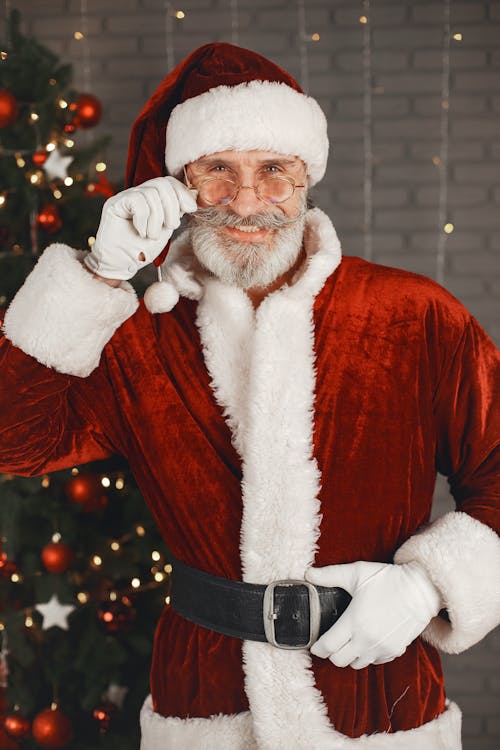 Smiling Elderly Man in Santa Costume