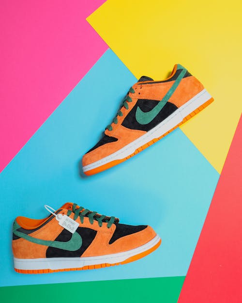Free Sneakers against a Colorful Background Stock Photo