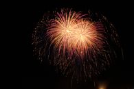 Vibrant fireworks illuminating the night sky with colorful explosions and sparkling effects.