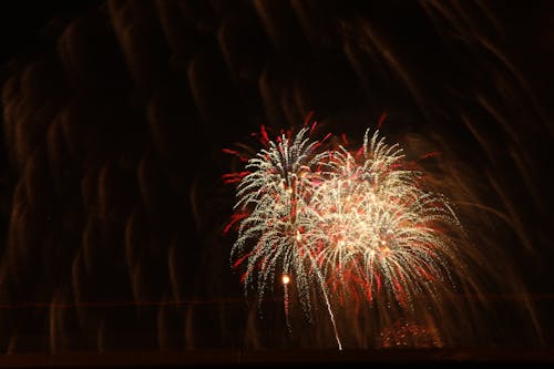 Yellow and Red Fireworks in Black Sky