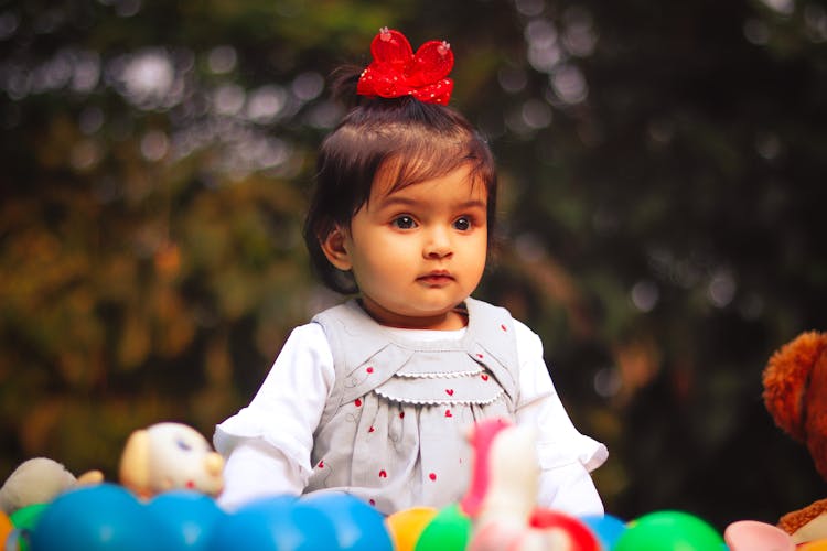 Portrait Of A Young Girl With A Hair Bow