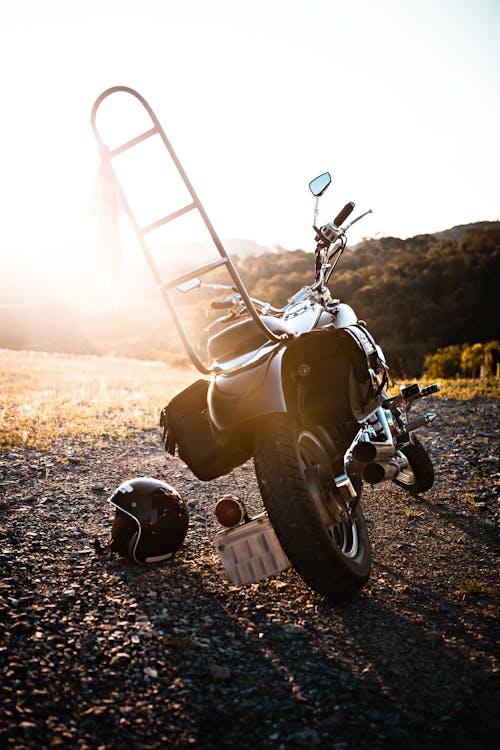 Free Chopper parked on rough rural road at sunset Stock Photo