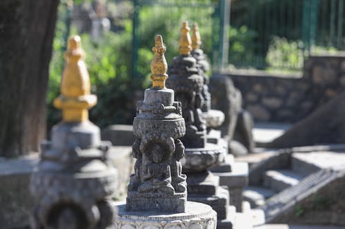Gray and Gold Stone Statues