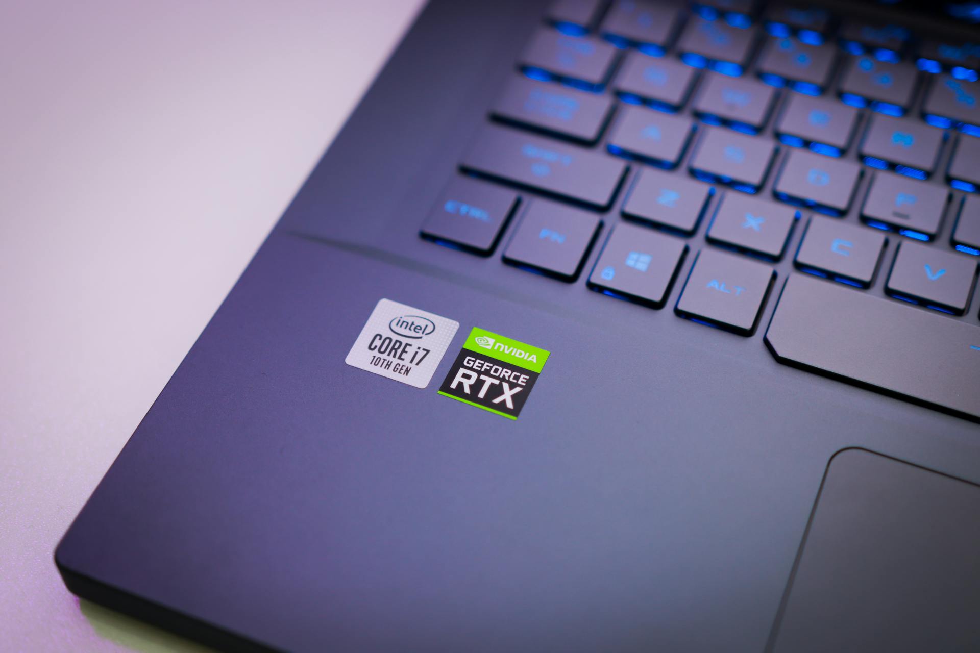 Laptop keyboard with Intel Core i7 and NVIDIA GeForce RTX stickers, symbolizing high-performance computing power.