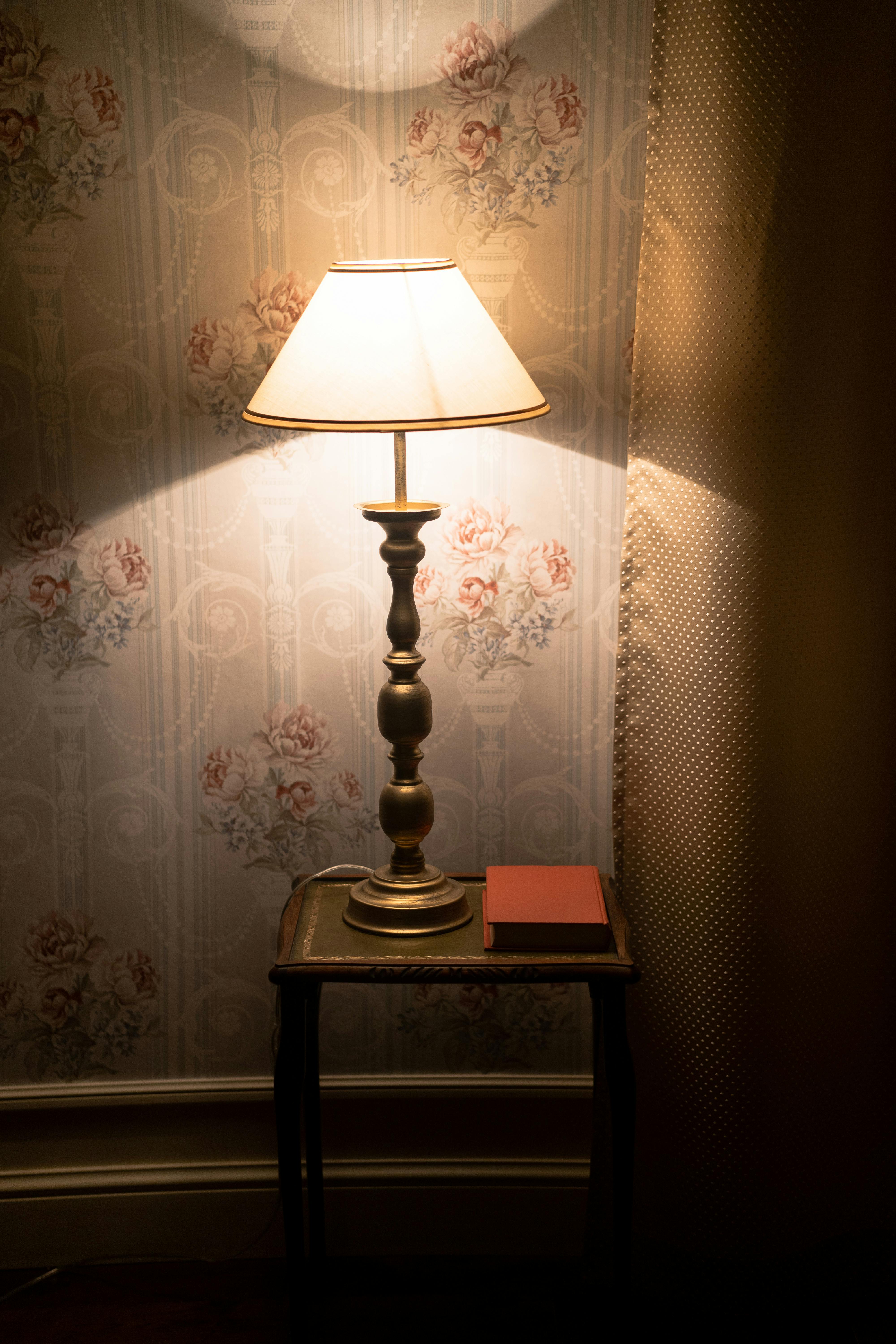 white table lamp on brown wooden table