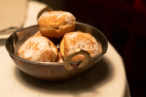 Brown Bread Buns on Stainless Steel Bowl