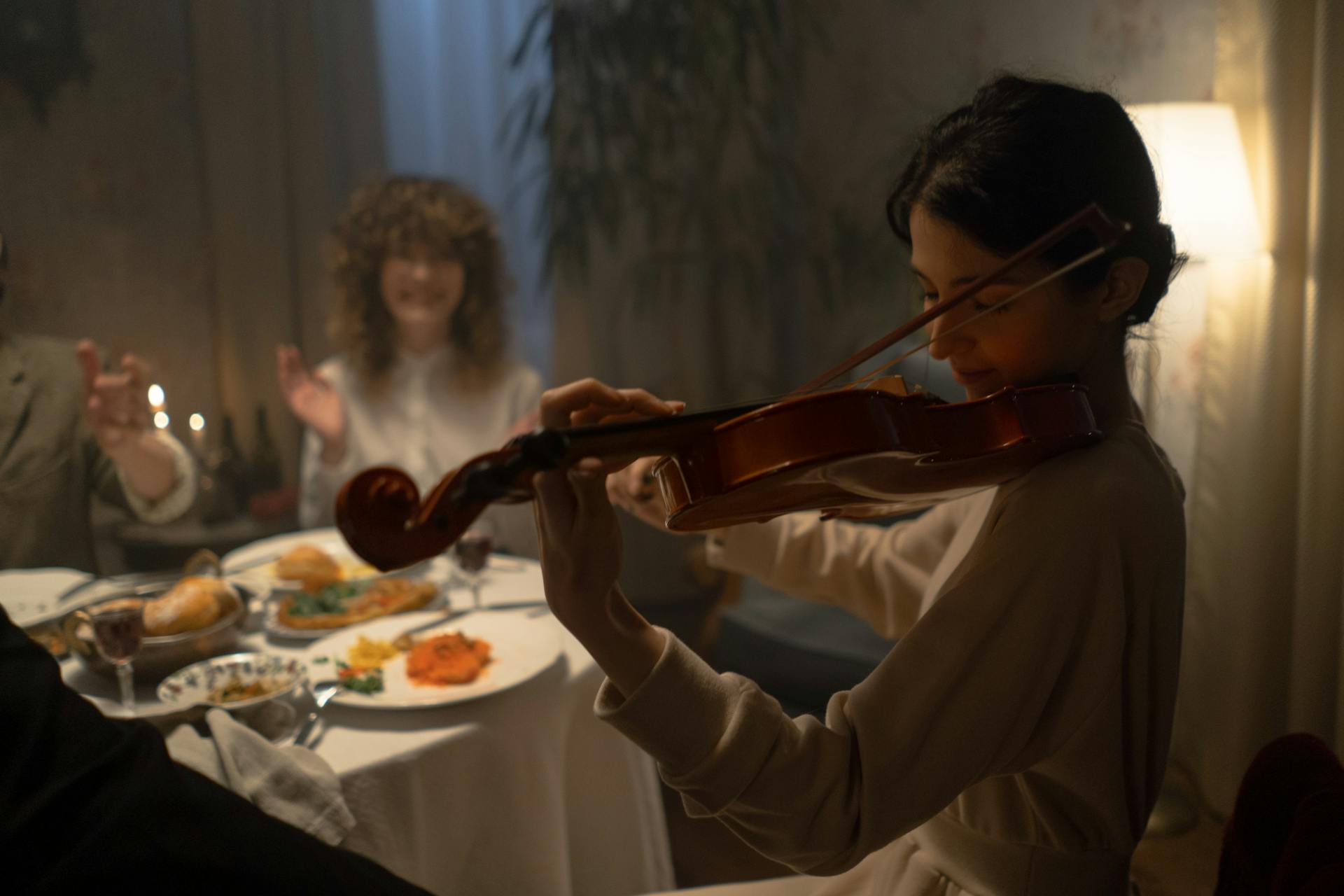 Woman Playing Violin For Entertainment