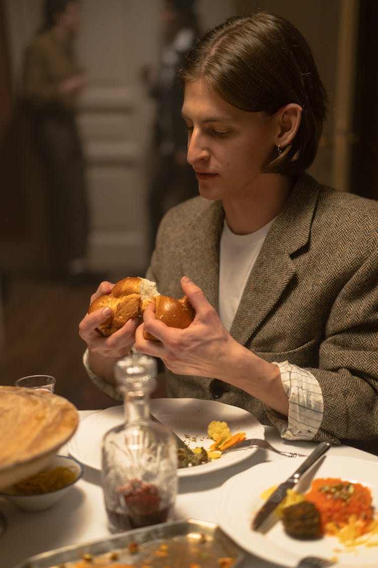 Man Holding A Challah Bread