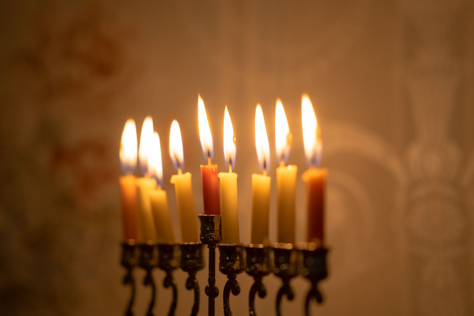 Close-up of a menorah with every candle burning