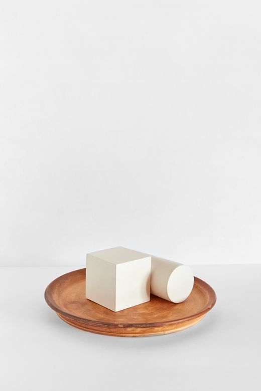 Geometric shapes on a wooden plate — Photo by DS stories on Pexels