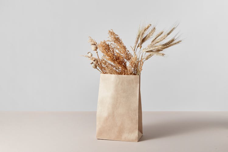 Dried Grass In Brown Paper Bag