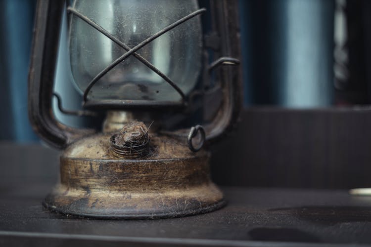 Dusty Lantern Lamp On Wooden Surface