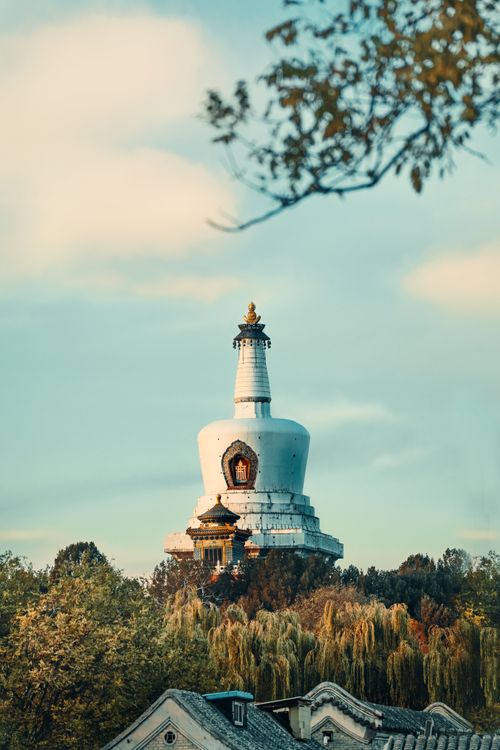 Free Historic White Dagoba temple in autumn at Beihai Park, Beijing, China, against a blue sky. Stock Photo