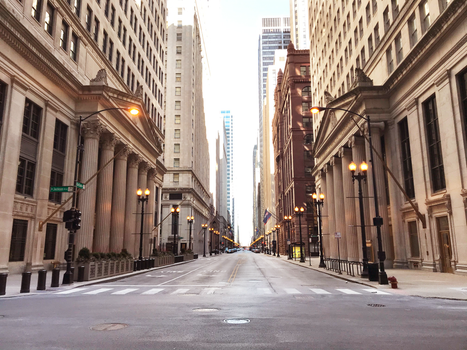 Empty street view in downtown Chicago showcasing historic architecture and cityscape.