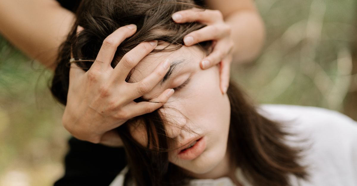 A Person Holding a Man's Face · Free Stock Photo