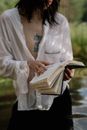 Woman in White Long Sleeve Shirt Reading Book