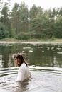 Woman in White Shirt Sitting on Dock