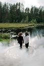 2 Women Standing on River