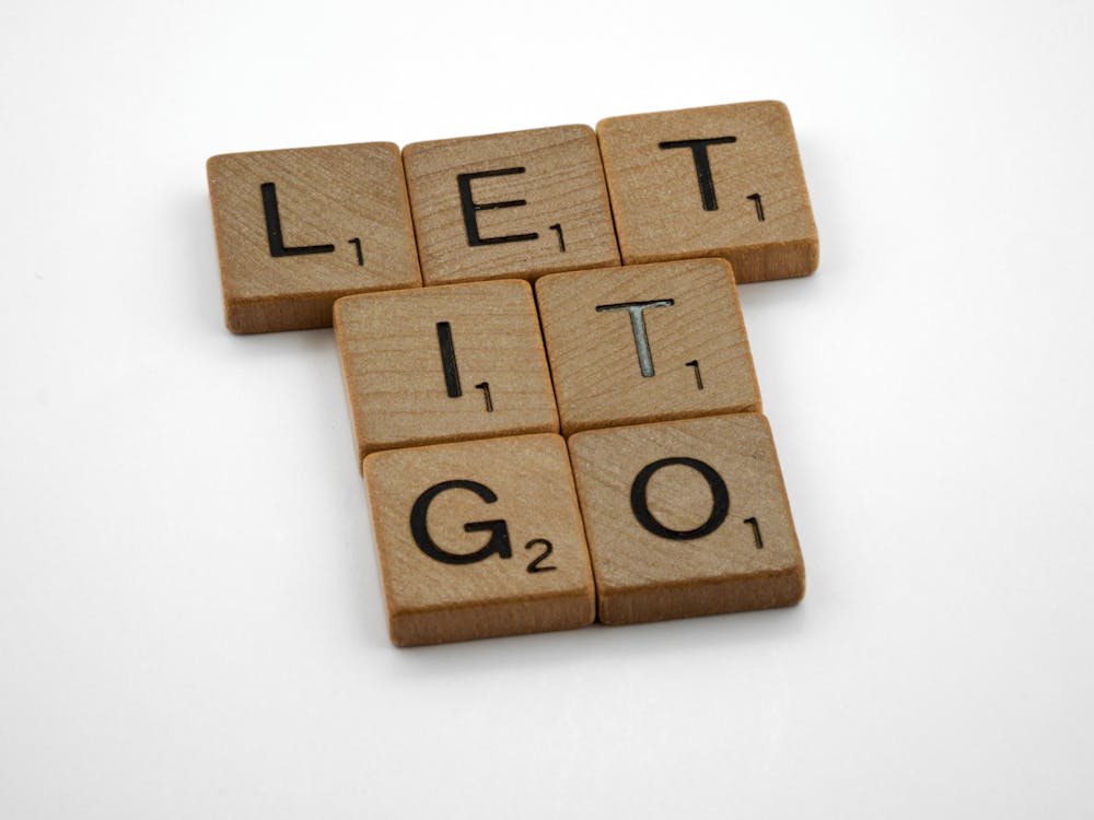 Free Brown Wooden Blocks with Message on a White Surface Stock Photo