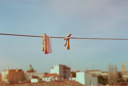 Free Clothespins Hanging on a Clothesline Stock Photo
