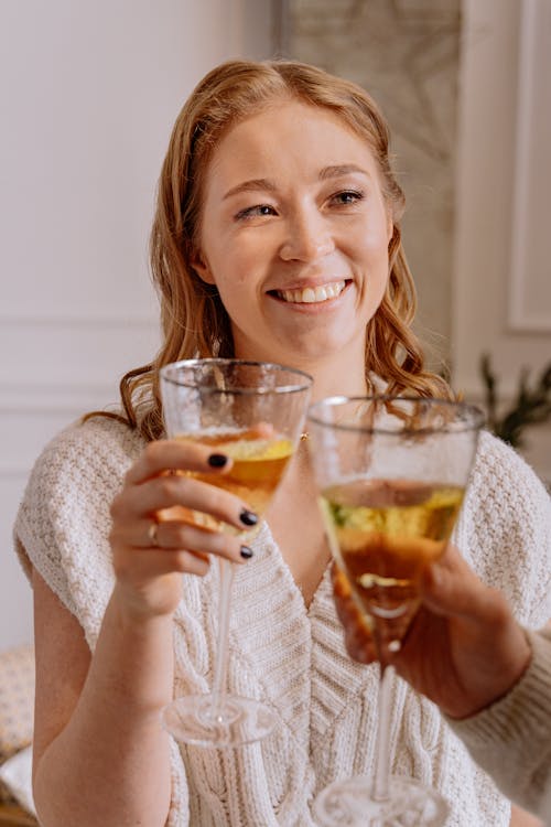 Smiling Woman Holding A Wine In Clear Glass