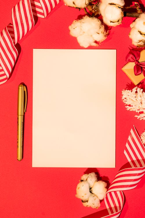 White Blank Printer Paper on Red Background