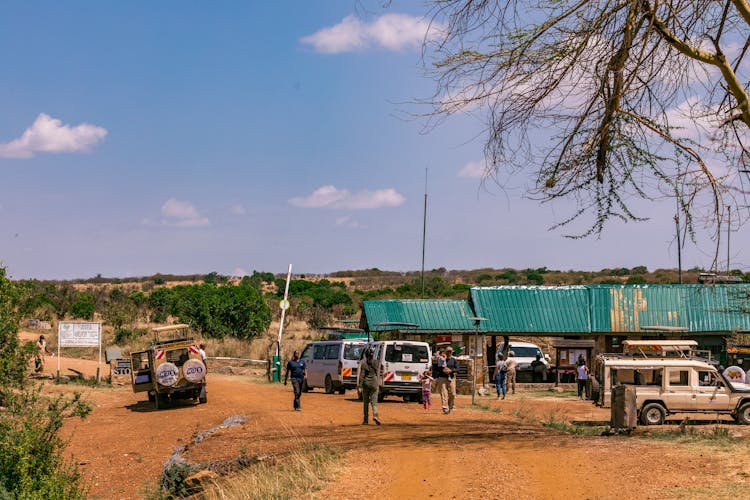 Off Road Vehicles And People In Desert Suburb