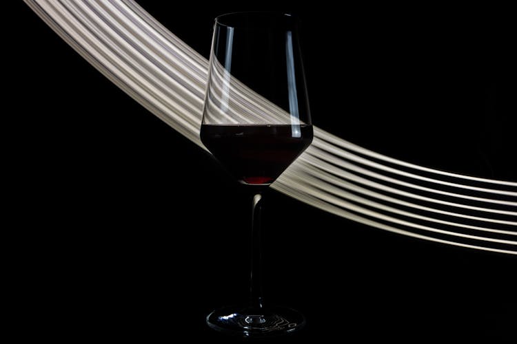 Wineglass Of Fine Red Wine On Black Background