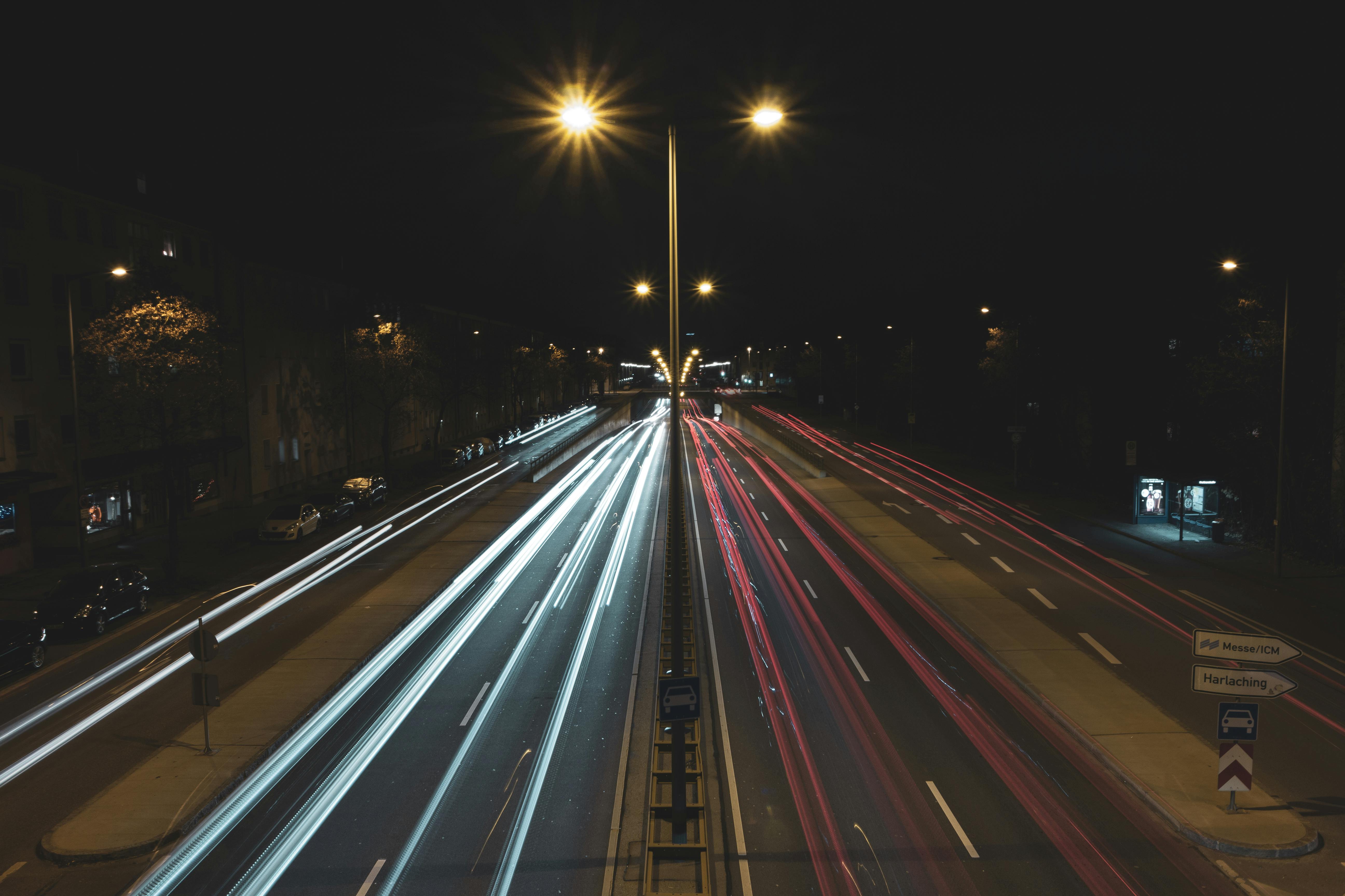 cars driving on highway at night