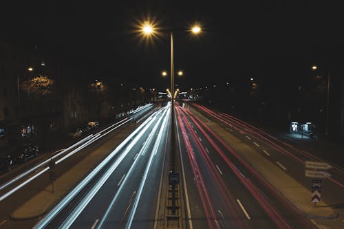 Free Long exposure cars driving on multiple lane  road in suburb at night Stock Photo