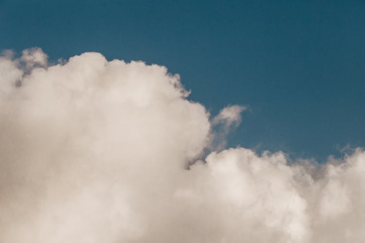 Background Of White Fluffy Cloud In Sky