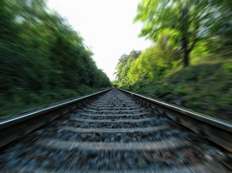 A dynamic view of railway tracks captured in motion with a long exposure effect.
