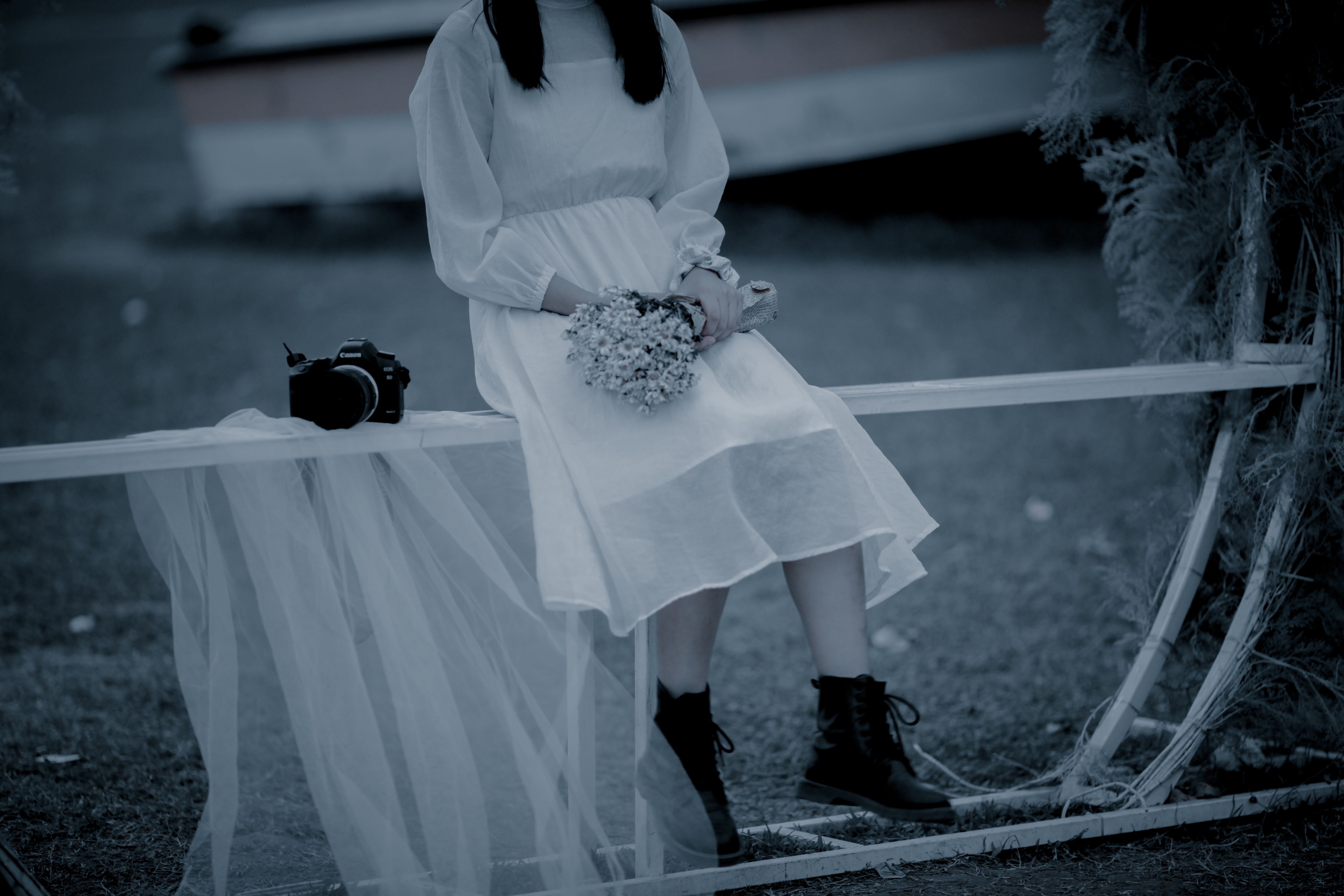 Woman in White Dress Holding A Bouquet of Flowers · Free Stock Photo