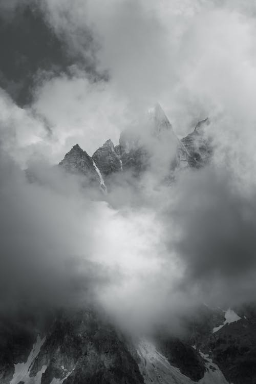 Free Mountain Covered With White Clouds Stock Photo