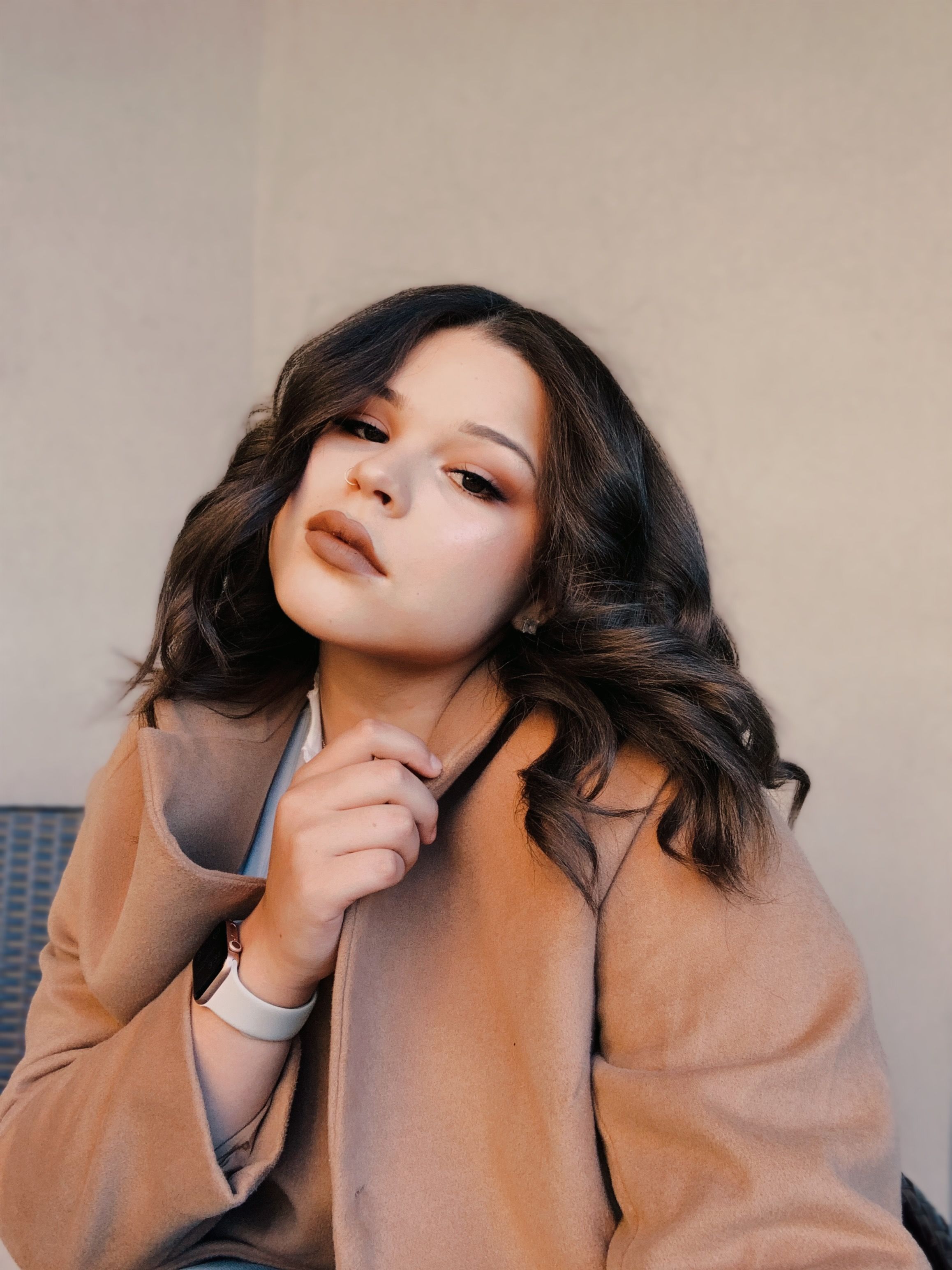 Close-Up Shot of an Attractive Woman in Brown Coat · Free Stock Photo