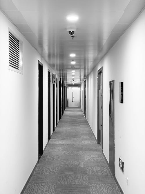 Free Grayscale Photo of an Empty Hallway Stock Photo