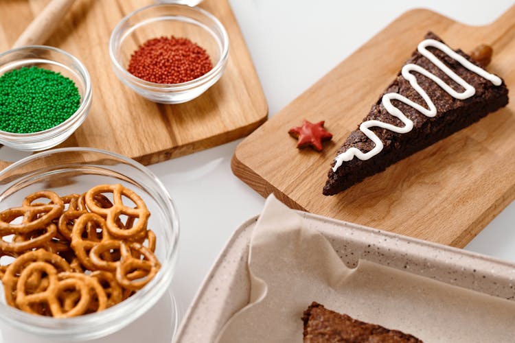 Triangle Shaped Brown Cookie On A Wooden Tray