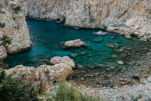 Free A stunning view of the rocky shoreline along Antalya's turquoise coast, showcasing natural beauty. Stock Photo