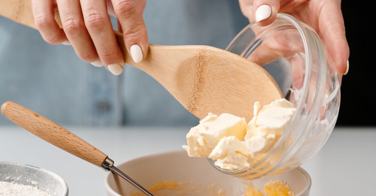Person Adding Butter into a Bowl · Free Stock Photo