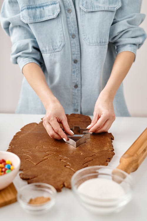 Free Person Using a Cookie Cutter Stock Photo
