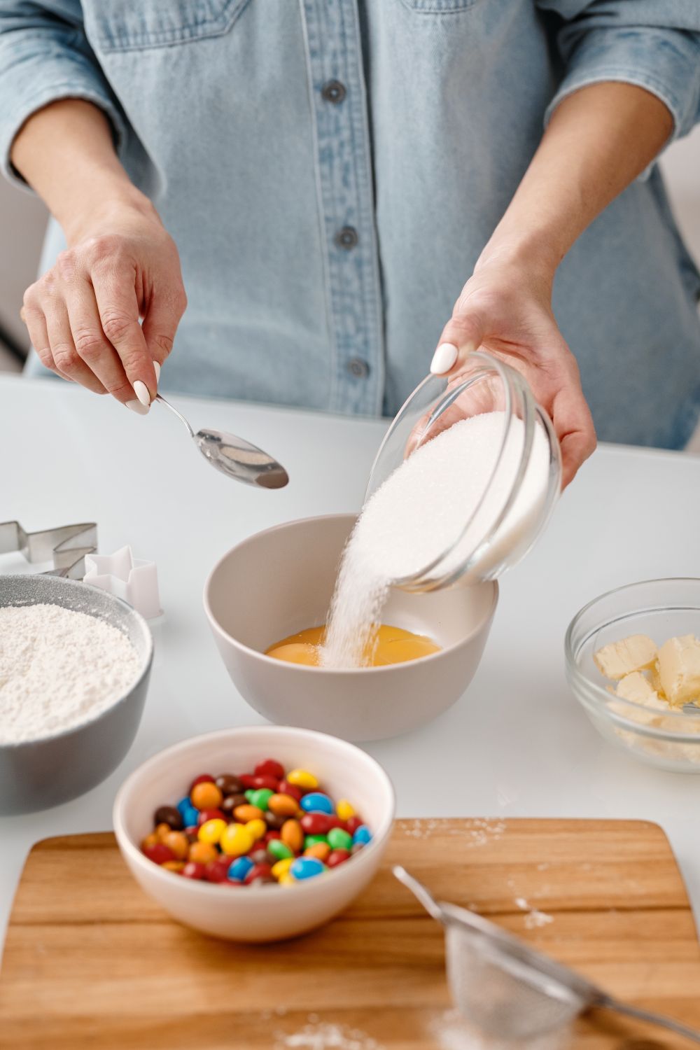 Person Pouring Powdered Sugar in a Bowl · Free Stock Photo