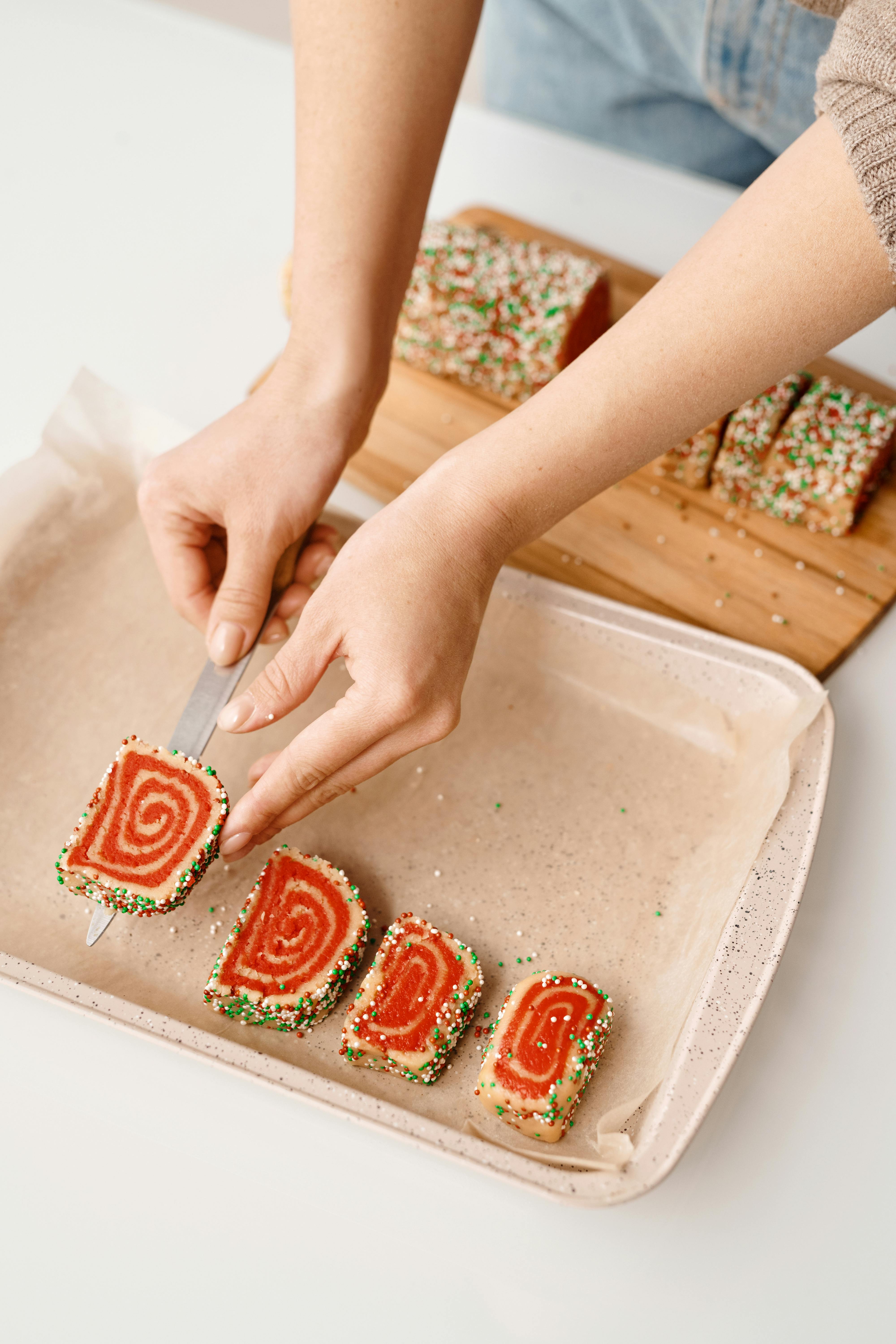 person putting a slice of cake on a tray