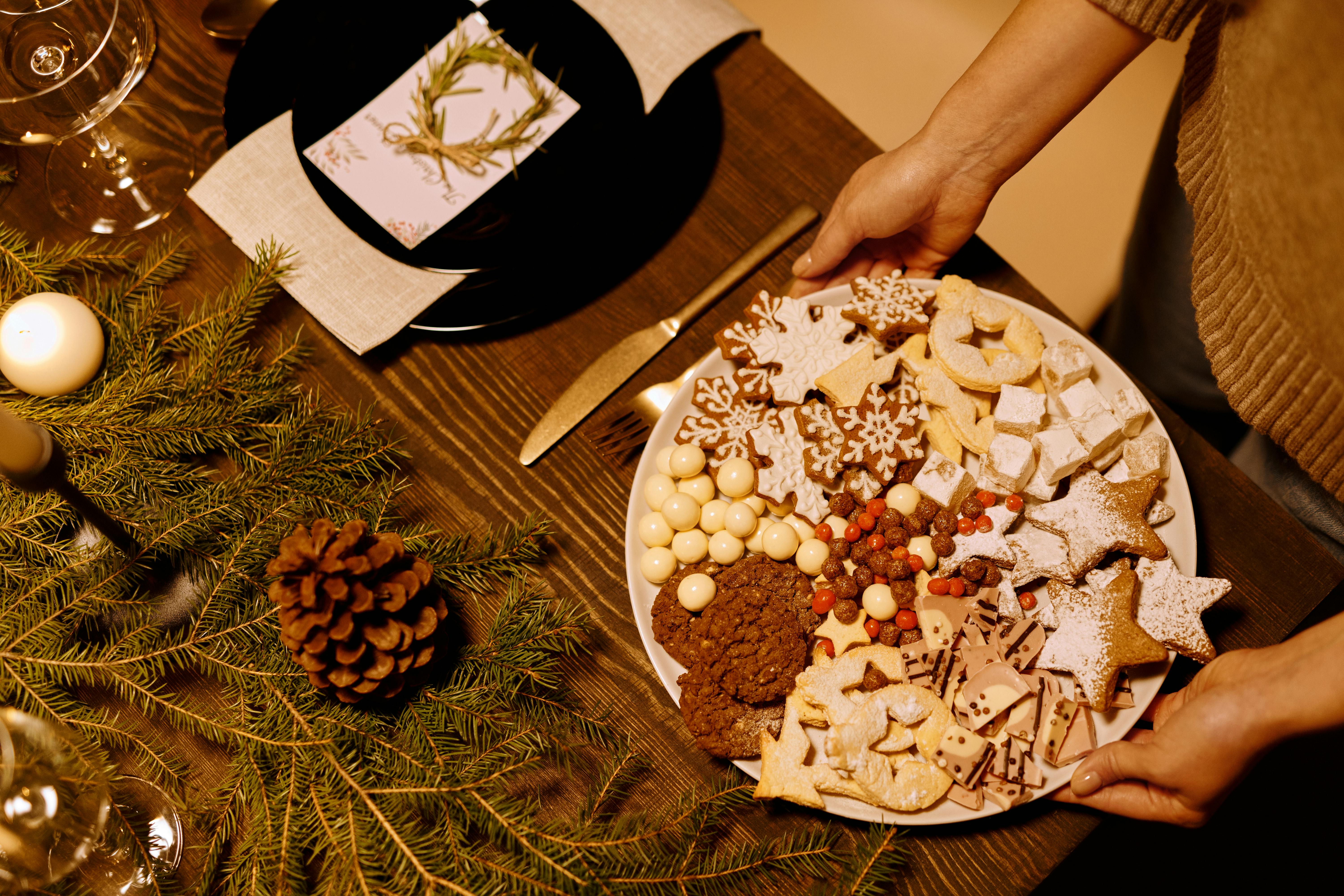 Person Serving a Platter of Homemade Biscuits