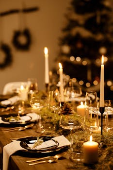 A beautifully decorated Christmas dinner table with candles and festive decor.