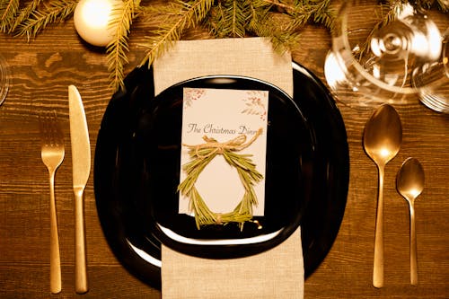 Free Top View of a Christmas Dinner Card on a Plate Stock Photo