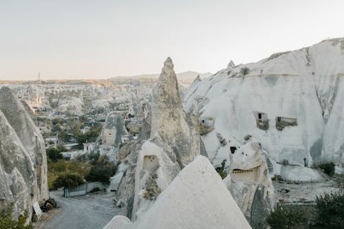 Amazing view of famous Cappadocia highlands with white rocky formations beneath clear blue sky